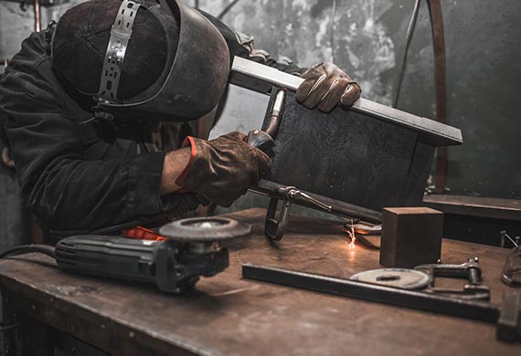 guy-works-with-a-welding-machine-using-a-mask-to-p-CVKNSPD